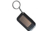 La mini linterna roja, color negro, azul de la antorcha del llavero de la energía solar del LED elige